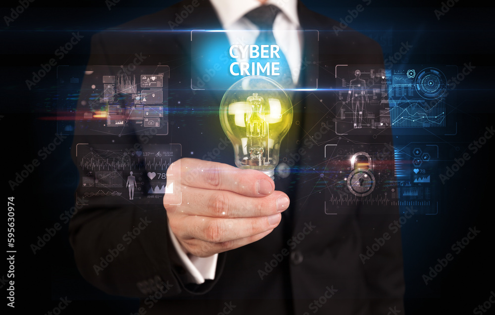 Businessman holding a light bulb, online security concept Businessman holding a light bulb, online security concept