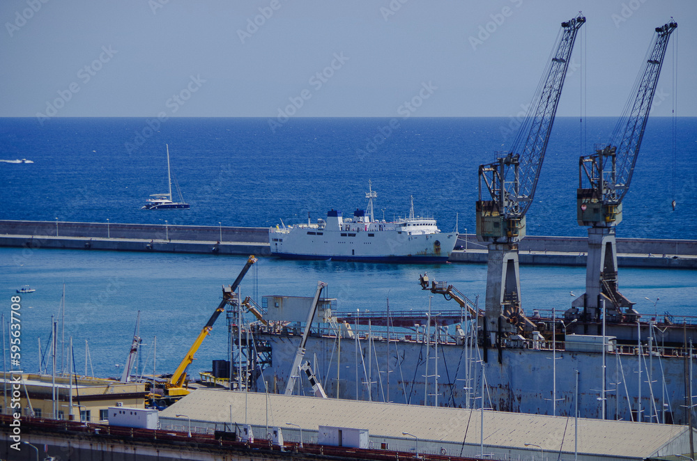 Fototapeta premium Passenger pax cargo car roro ro-ro ferry boat vessel cruiseship cruise ship liner in Palermo Sicily, Italy port with blue sky