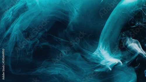 Color mist. Smoke cloud. Paint water wave. Blue glowing sparkling glitter particles fog floating on dark black abstract art background with free space.