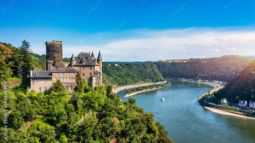 Katz castle and romantic Rhine in summer at sunset, Germany. Katz Castle or Burg Katz is a castle ruin above the St. Goarshausen town in Rhineland-Palatinate region, Germany