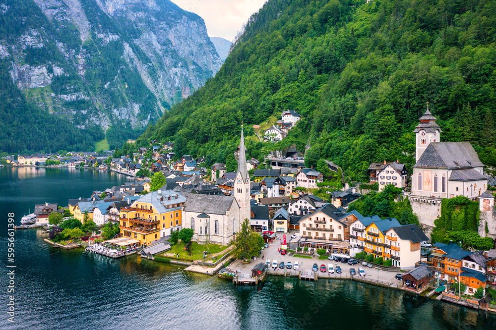 Fototapeta premium Aerial view of austrian mountain village Hallstatt and Hallstatter lake. Beautiful summer time. Salzkammergut, Austria. Hallstatt village over Hallstatter See, in Salzkammergut, Austria.