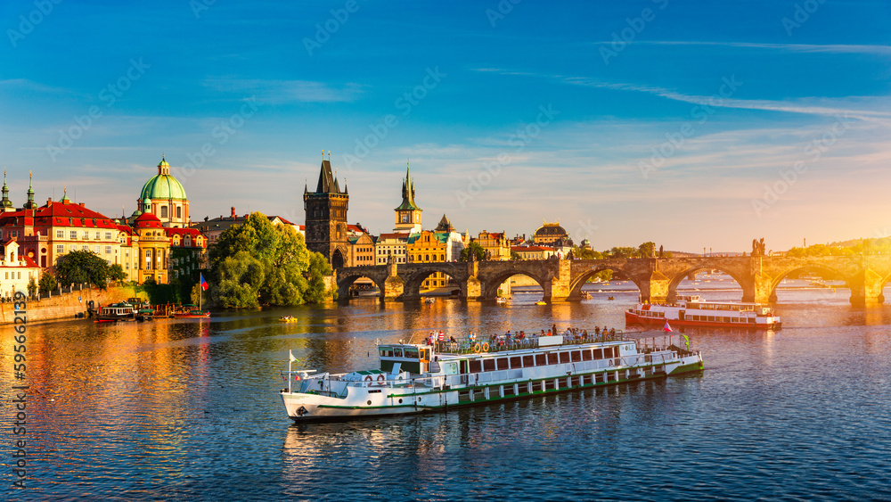 Charles Bridge in Prague in Czechia. Prague, Czech Republic. Charles Bridge (Karluv Most) and Old Town Tower. Vltava River and Charles Bridge. Concept of world travel, sightseeing and tourism.