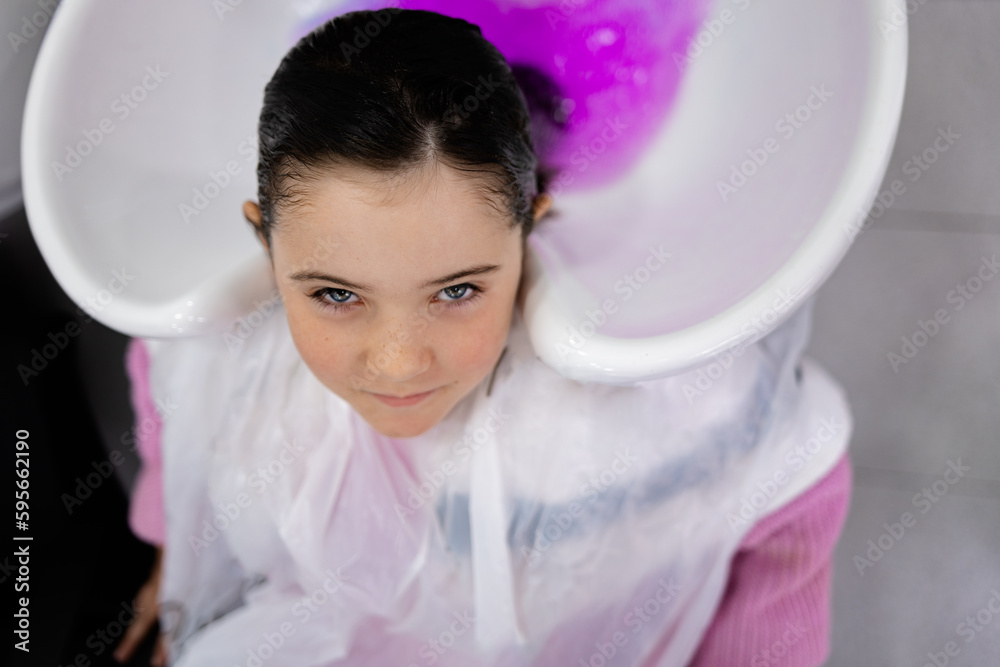 Smiling child washing hair in shampoo bowl Stock Photo Adobe Stock