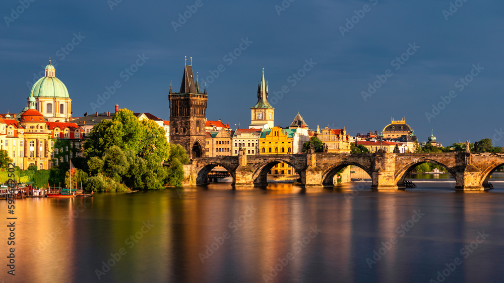 Fototapeta premium Charles Bridge sunset view of the Old Town pier architecture, Charles Bridge over Vltava river in Prague, Czechia. Old Town of Prague with Charles Bridge, Prague, Czech Republic.