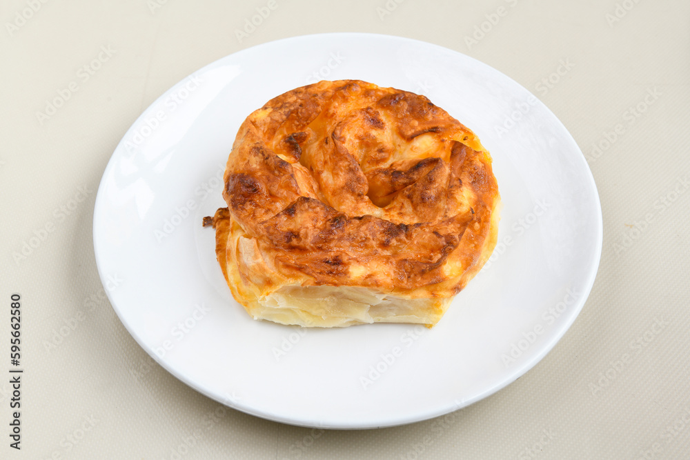 Turkish style meat stuffed filo dough borek served kol boregi. Cheese and minced pie are sliced on a marble background. Turkish name: Kol Boregi, ispanakli, kiymali, Su Boregi