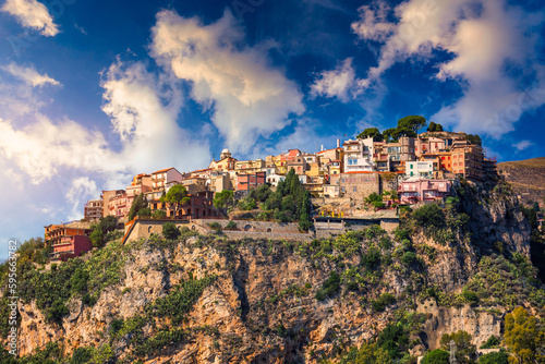 Castelmola: typical sicilian village perched on a mountain, close to Taormina. Messina province, Sicily, Italy. Castelmola town on rocky mountain top in Sicily, Italy. photo