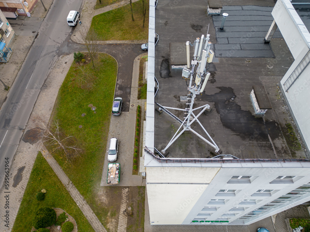 New GSM antennas on the roof of a residential building for transmitting