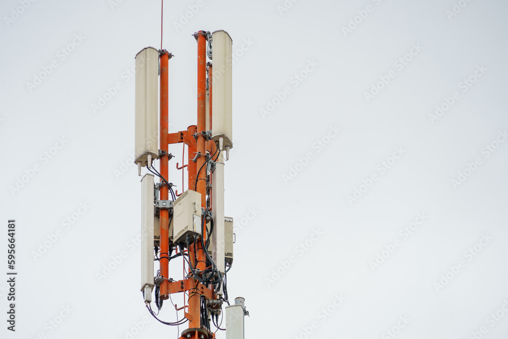 New GSM antennas on a tower against a blue sky for transmitting a 5g signal are dangerous. Radiation pollution of the environment through cell towers. New technologies in the field of communication. New GSM antennas on a tower against a blue sky for transmitting a 5g signal are dangerous. Radiation pollution of the environment through cell towers. New technologies in the field of communication.