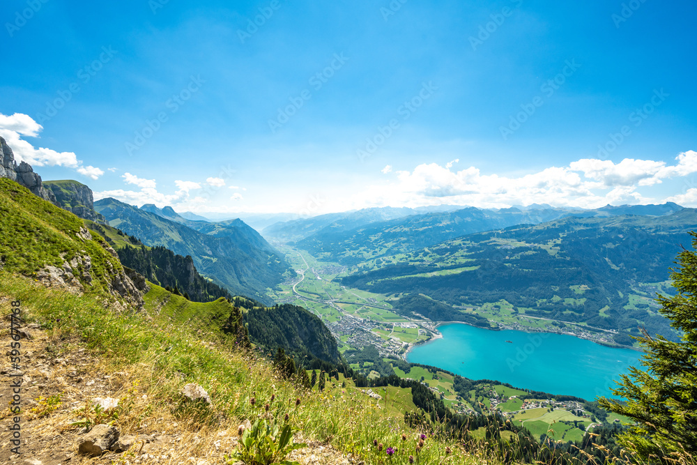 View of Walensee with the swiss alps in the background. Schnürliweg, Walensee, St. Gallen, Switzerland, Europe.