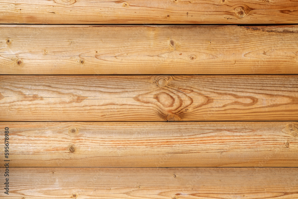 Wall made of yellow wooden panels with multiple knots as a background Wall made of yellow wooden panels with multiple knots as a background