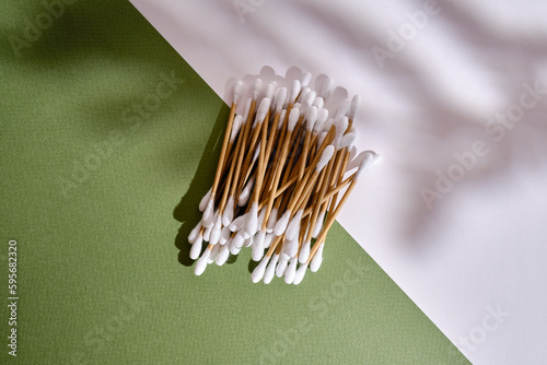 Bamboo cotton buds on a colored background. Biodegradable ear swabs. Eco product photo