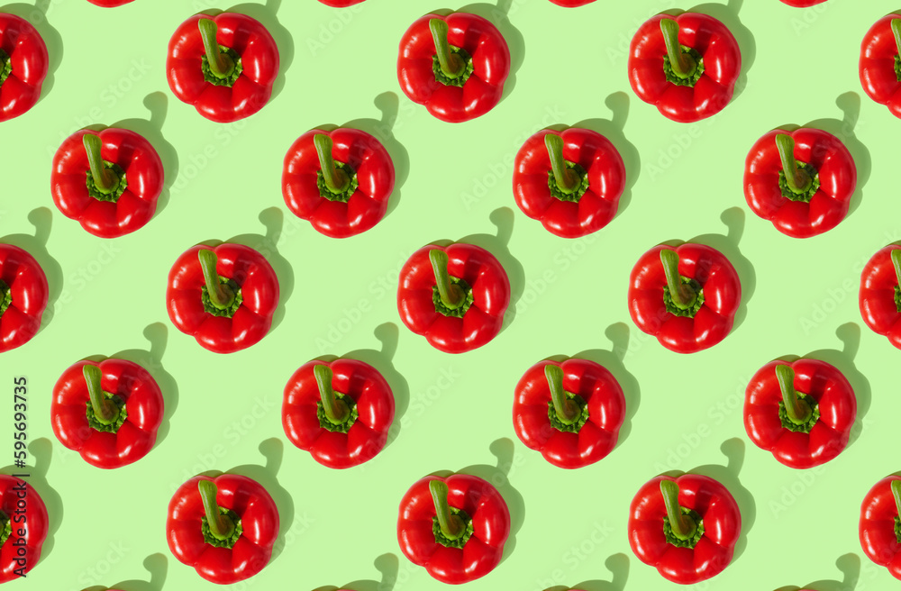 Pattern of red peppers on green pastel background Pattern of red peppers on green pastel background