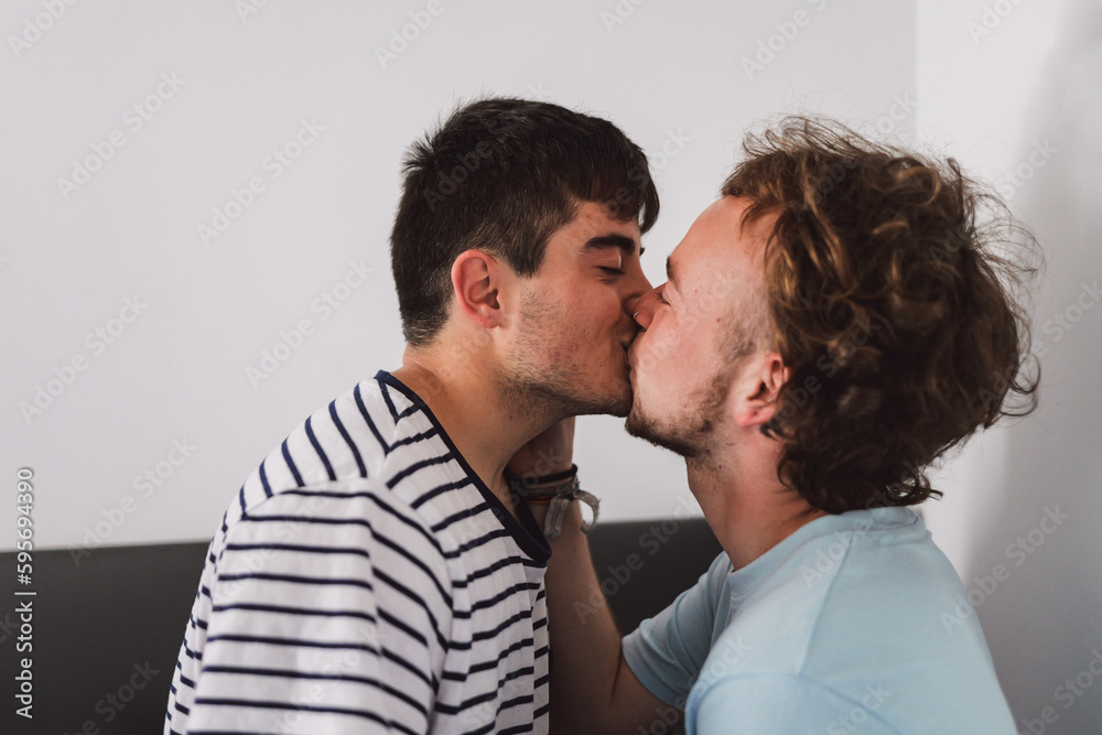 Happy gay couple standing close to each other Happy gay couple standing close to each other