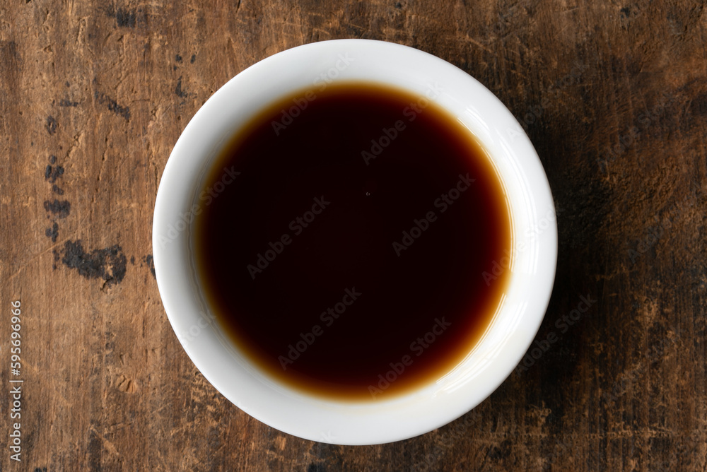 Fotografie Pure Vanilla Extract in a Bowl