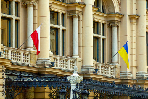 Ukrainian and Polish flags on the facade of the Juliusz Slowacki Theatre. is a 19th-century Eclectic theater-opera house in the heart of Krak w, Poland, and a UNESCO World Heritage Site.