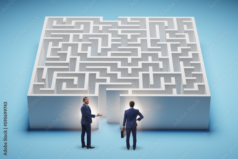 Businessman trying to find a way out of maze Businessman trying to find a way out of maze