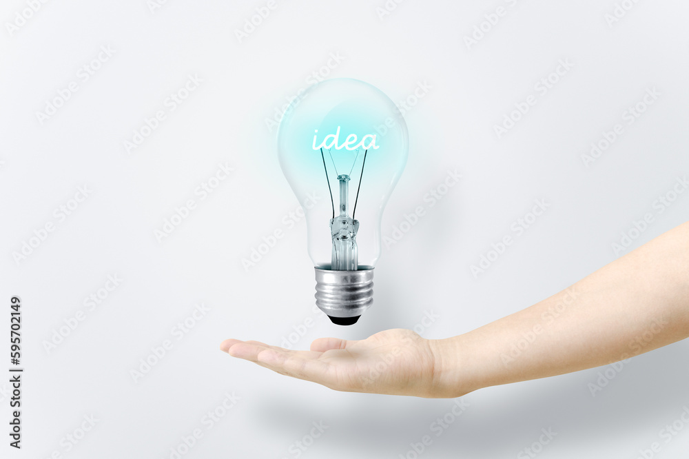 Idea text glowing inside a light bulb. Idea text glowing inside a light bulb.