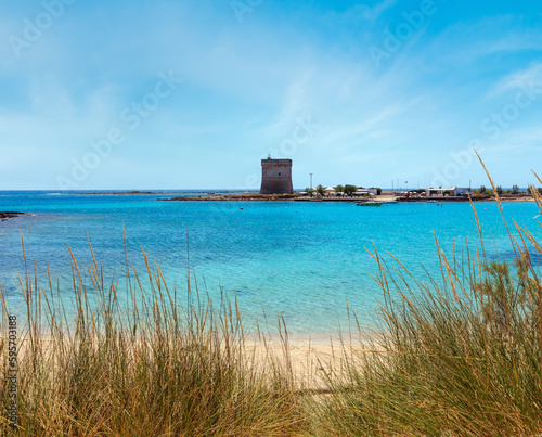 Fototapeta Naklejka Na Ścianę i Meble -  Picturesque Torre Chianca beach and historical fortification tower Torre Chianca (Torre Santo Stefano) on Salento Ionian sea coast, Porto Cesareo, Puglia, Italy