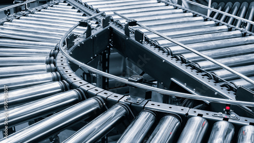Foto Crossing of the roller conveyor, Production line conveyor roller transportation