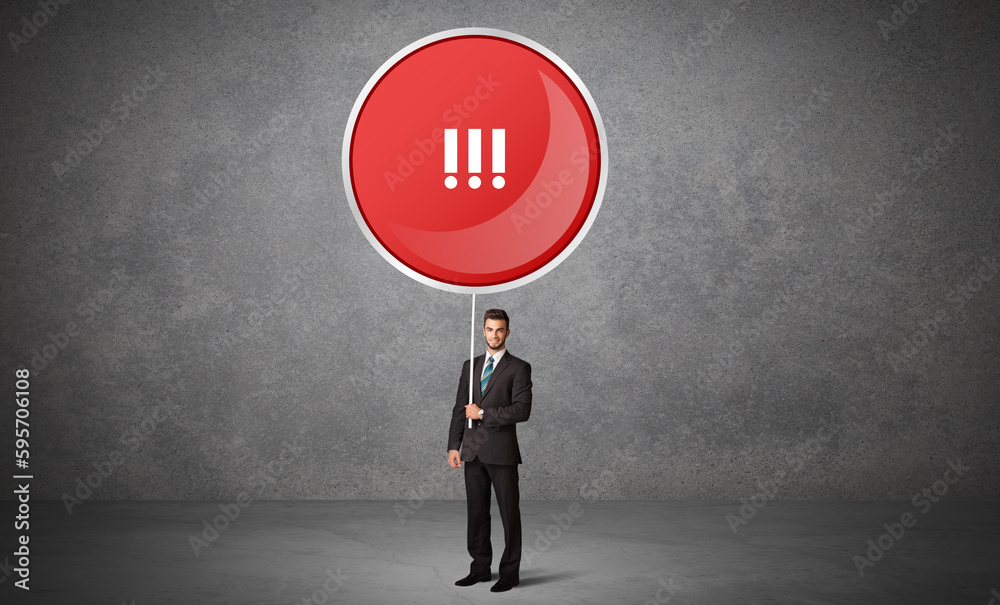 Obraz premium Young business person holdig traffic sign concept