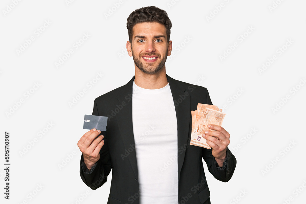 Young businessman comparing payment methods, holding euros in one hand and a credit card in the other. Young businessman comparing payment methods, holding euros in one hand and a credit card in the other.