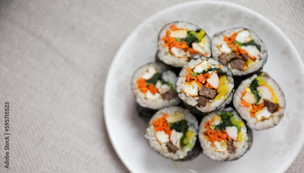 Kimbap is a traditional Korean dish made of rice, vegetables, and meat or seafood rolled in seaweed. It represents the country's rich culinary heritage and cultural diversity Kimbap is a traditional Korean dish made of rice, vegetables, and meat or seafood rolled in seaweed. It represents the country's rich culinary heritage and cultural diversity