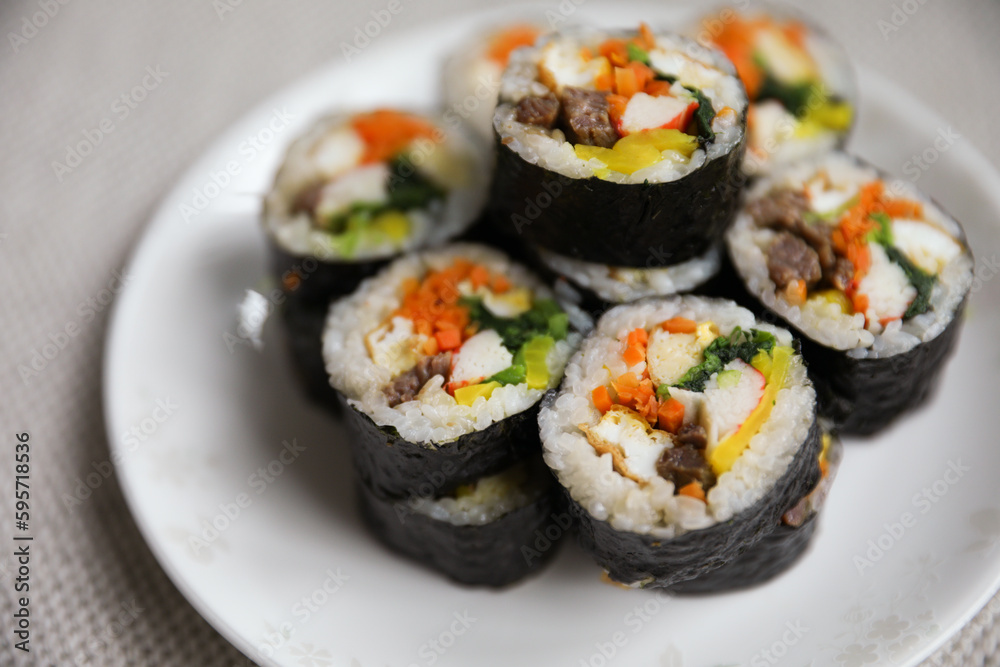 Kimbap is a traditional Korean dish made of rice, vegetables, and meat or seafood rolled in seaweed. It represents the country's rich culinary heritage and cultural diversity Kimbap is a traditional Korean dish made of rice, vegetables, and meat or seafood rolled in seaweed. It represents the country's rich culinary heritage and cultural diversity