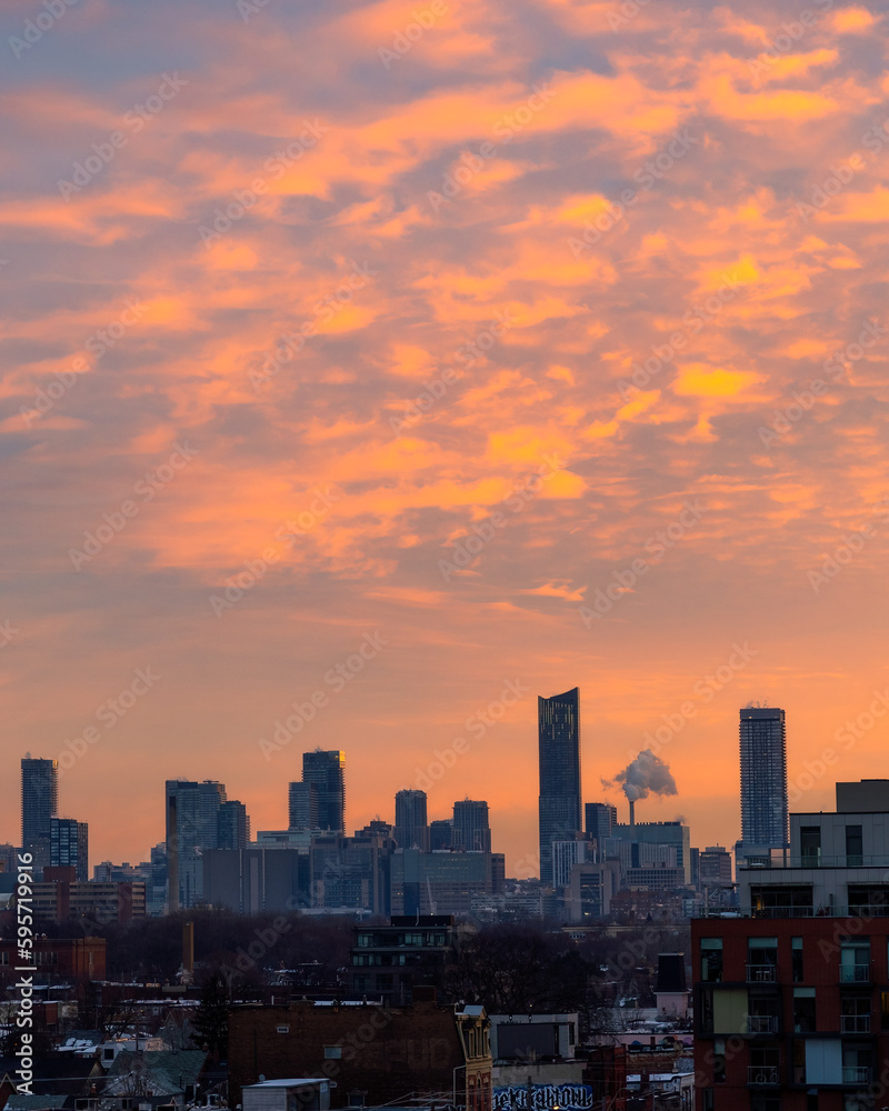 Colorful sunrise sky over downtown Toronto skyline and condo skyscrapers