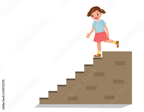 Cute little girl going downstairs photo