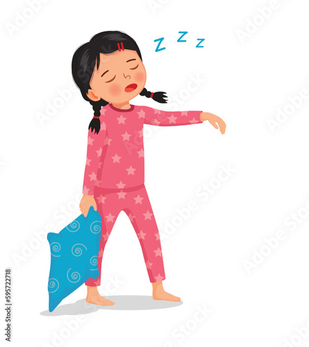 Cute little girl in pajamas holding pillow sleepwalking at night  photo