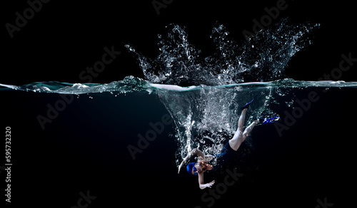 Professional woman swimmer on a wave © Sergey Nivens