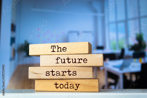 Wooden blocks with words 'The future starts today'.