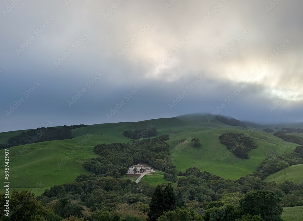 Fototapeta premium clouds over the house on the East San Francisco Bay hills