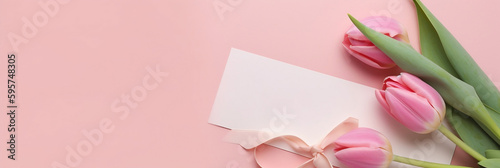 Greeting card mockup with pink tulips on a pink background and blank paper, Mother's Day, flat lay, top view, Generative AI © NE97