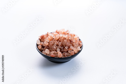 Himalayan pink salt is herb seasoning from himalaya and isolated on white background with copy space