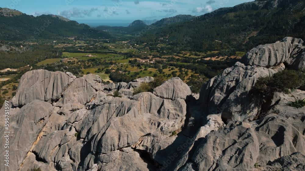 Port de Soller Sa Calobra mountain tops in Palma de Mallorca. Green hills, forest and rock formations. Scenic idyllic Majorca Island mountain ridge peak nature aerial drone footage. Cinematic 4K UHD. Port de Soller Sa Calobra mountain tops in Palma de Mallorca. Green hills, forest and rock formations. Scenic idyllic Majorca Island mountain ridge peak nature aerial drone footage. Cinematic 4K UHD.