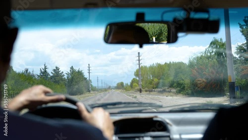 Wallpaper Mural A man drives down the road in Mendoza, Argentina in slow motion and puts his hand to the wheel Torontodigital.ca