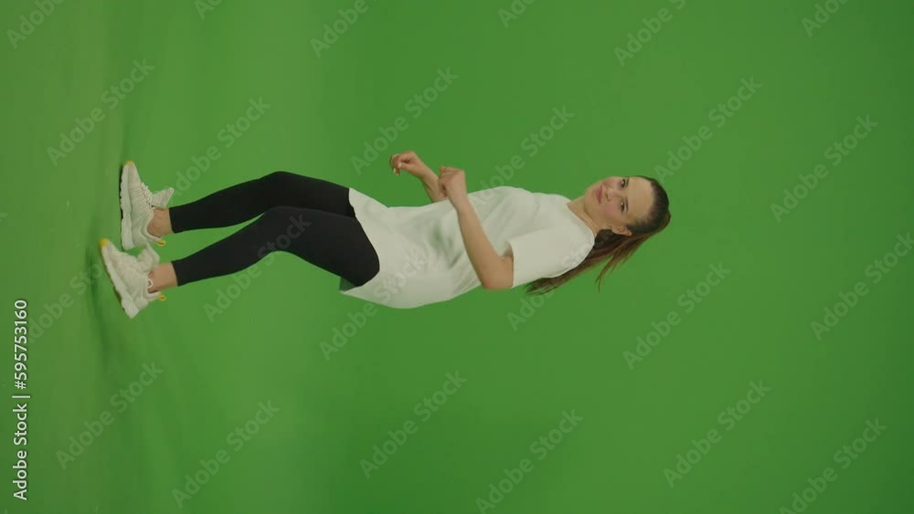 Vertical Video. Female Dancer Performing a Dance on Green Screen. Chroma Key. Green Screen. Modern Lifestyle, Happiness Concept. Breakdancing, Hip-Hop Dancing, Street Dancing Vertical Video. Female Dancer Performing a Dance on Green Screen. Chroma Key. Green Screen. Modern Lifestyle, Happiness Concept. Breakdancing, Hip-Hop Dancing, Street Dancing