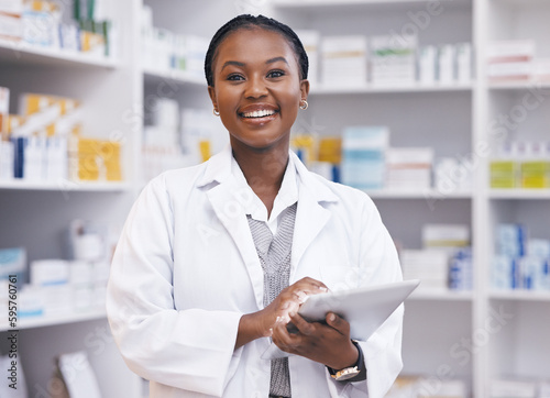 Portrait of black woman in pharmacy with tablet, smile and online inventory list for medicine on shelf. Happy female pharmacist, digital checklist and medical professional checking stock in store.
