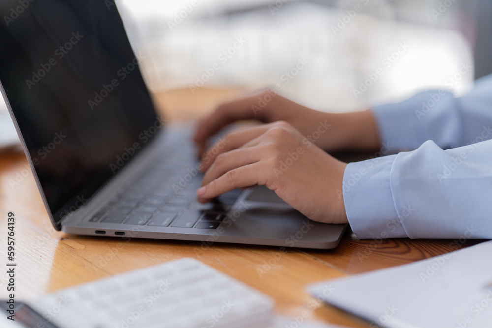 Business Documents concept : Employee woman hands working in Stacks paper files for searching and checking unfinished.