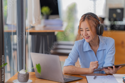 Young student who learns with online platform at coffee shop or co-working space 