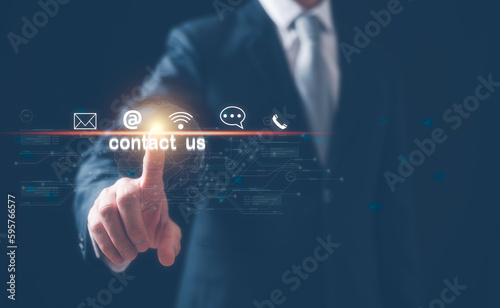 the concept of Contact us or Customer support hotline people connect. Businessman touching on virtual screen contact icons email, address, live chat, internet wifi, internet network connection