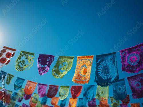 The confetti is an ornamental paper craft product that is worked in Mexico and serves to decorate festivities of the day of the dead.Papel picado. Decorations for the day of the dead, minced paper © Abhishek