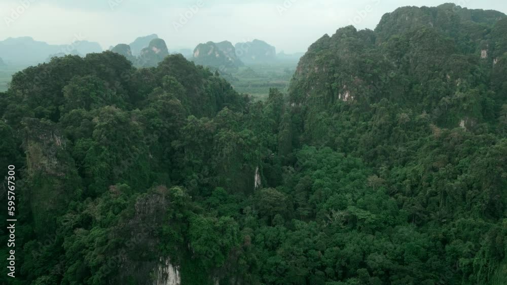Aerial view scenery fly at beautiful mountains in tropical rainforest. Cinematic video drone flight in mountainous scenery over green authentic wild jungle. Paradise tropical rainforest. Aerial view scenery fly at beautiful mountains in tropical rainforest. Cinematic video drone flight in mountainous scenery over green authentic wild jungle. Paradise tropical rainforest.