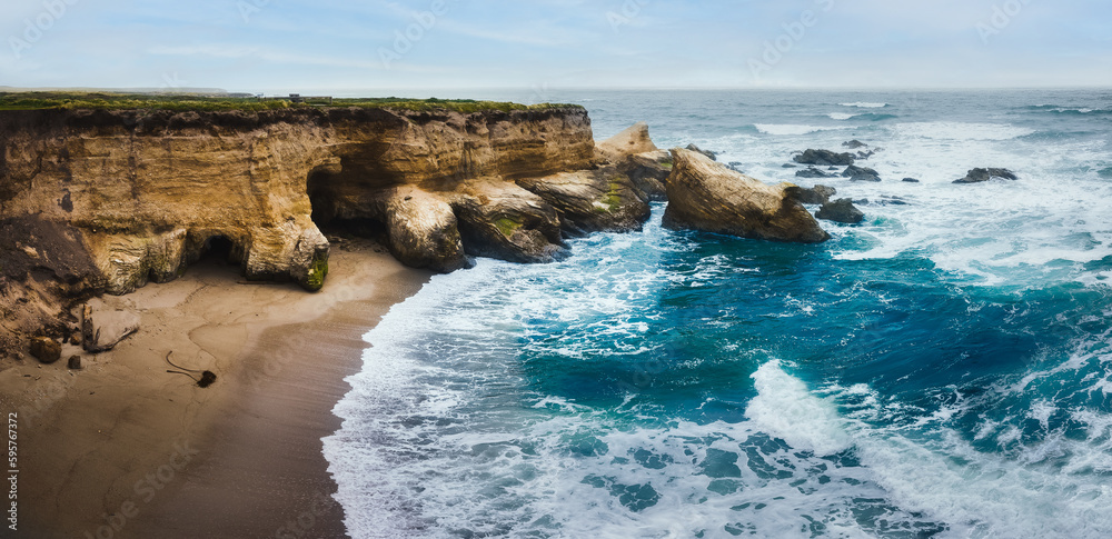 Obraz premium Dramatic coastline landscape, pano. Rocky Cliffs, Pacific Ocean, and native plants on the beach, Montana de Oro State Park, California