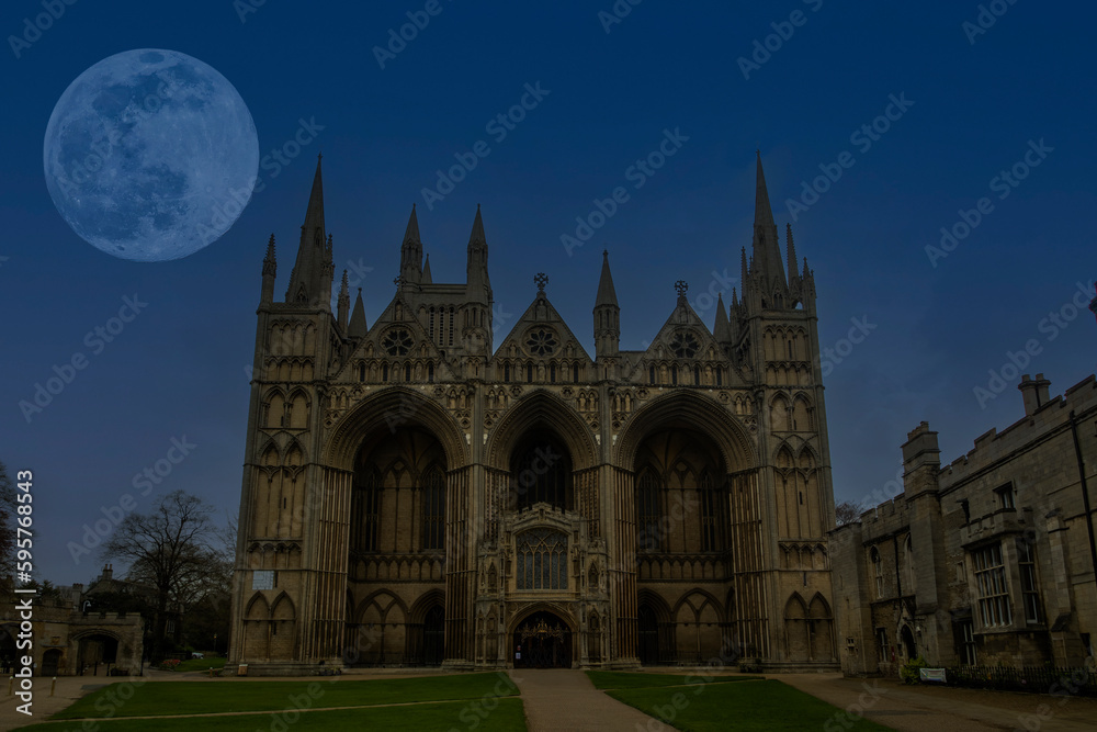 Full moon over the Cathedral Church of St Peter, St Paul and St Andrew in Peterborough, Cambridgeshire, UK