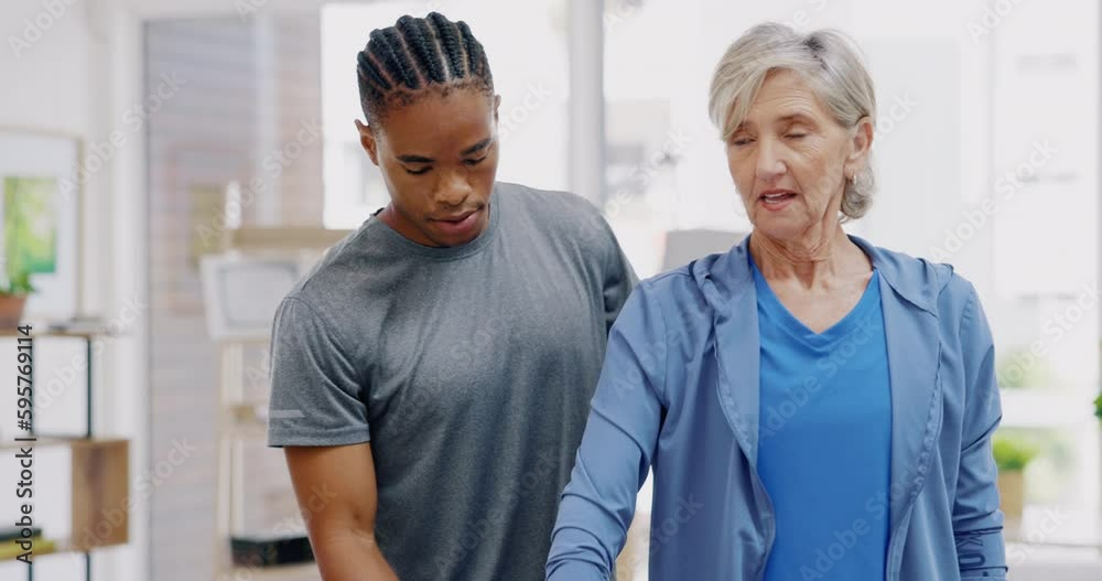 Senior woman, nurse and rehabilitation with dumbbells exercise in a nursing home for fitness. Elderly patient with a therapist man for healing, health and physiotherapy for arms, muscle and body