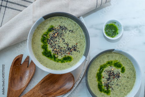 Healthy creamy soup with fresh ramson or wild garlic leaves