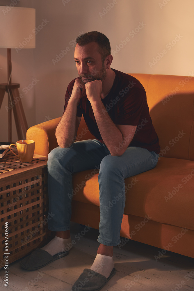 Bored man with lethargy and apathy sitting at home alone. Bored man with lethargy and apathy sitting at home alone.