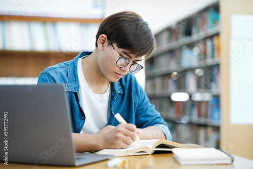 Student studying at library.